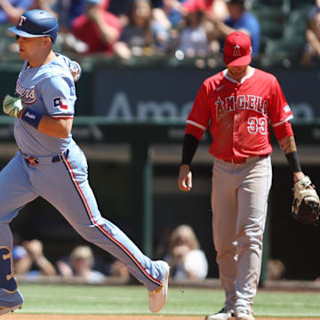 Sep 8, 2024; Arlington, Texas, USA; Texas Rangers first base Nathaniel Lowe (30) rounds the bases after hitting a two run home run against the Los Angeles Angels in the first inning at Globe Life Field. Mandatory Credit: Tim Heitman-Imagn Images