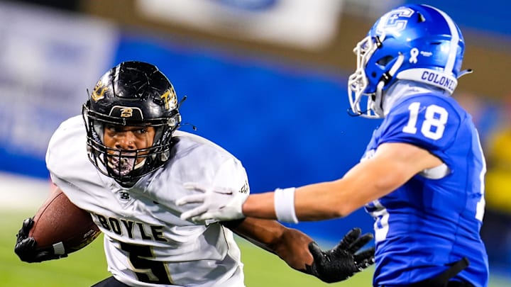 Boyle County (Kentucky) all-purpose player Montavin Quisenberry, left, did it all Saturday in a win over St. Edward (Ohio).