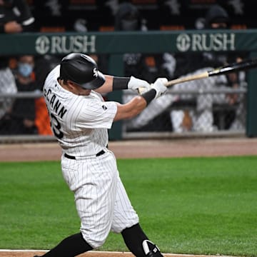 Chicago White Sox catcher James McCann (33) hits a RBI single against the Minnesota Twins during the third inning at Guaranteed Rate Field in 2020.