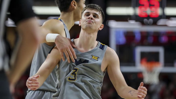 Mar 9, 2024; Cincinnati, Ohio, USA; West Virginia Mountaineers guard Kerr Kriisa (3) reacts after a foul called on him during the first half in the game against the Cincinnati Bearcats at Fifth Third Arena. Mandatory Credit: Katie Stratman-USA TODAY Sports