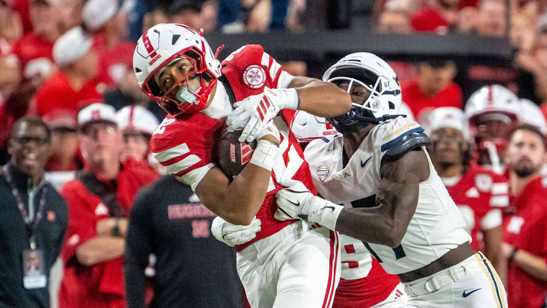On a night when Nebraska needed to develop running back depth, Isaiah Mozee carries the ball after making a catch during the third quarter against Akron.