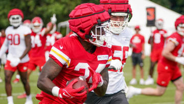 Jul 24, 2023; St. Joseph, MO, USA; Kansas City Chiefs running back Deneric Prince (34) runs the ball as defensive end George Karlaftis (56) chases during training camp at Missouri Western State University. Mandatory Credit: Denny Medley-USA TODAY Sports