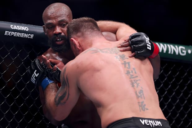 Jon Jones (red gloves) fights Stipe Miocic (blue gloves) in the heavyweight bout during UFC 309 at Madison Square Garden. 