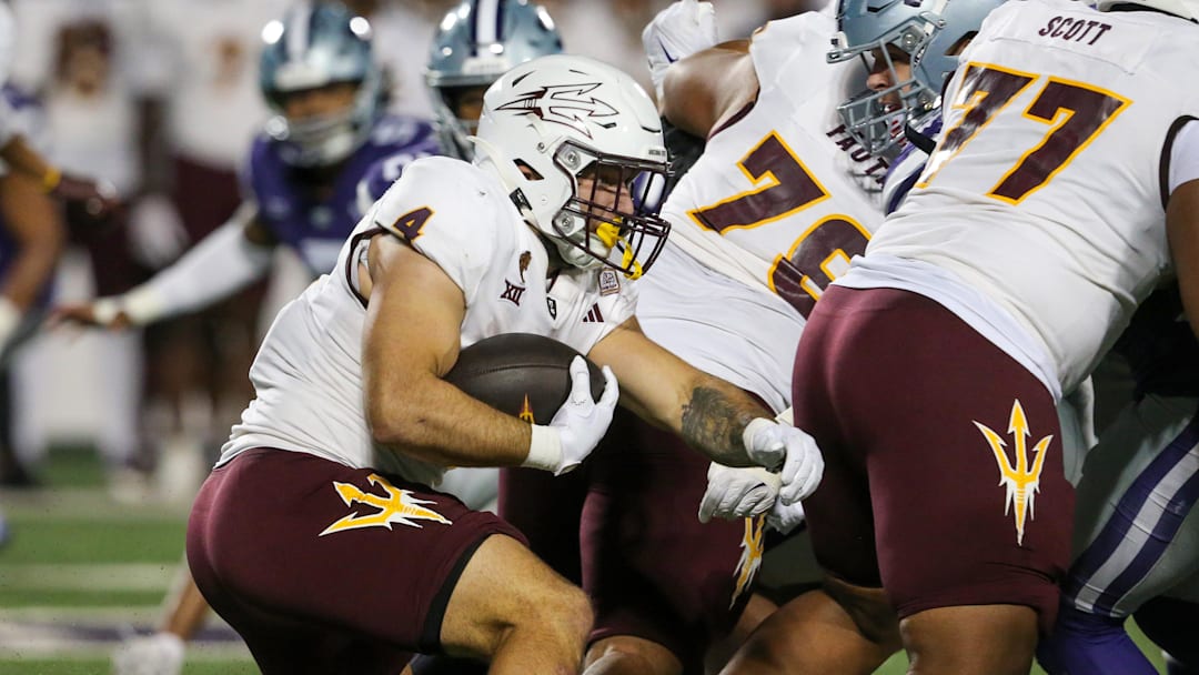 Nov 16, 2024; Manhattan, Kansas, USA; Arizona State Sun Devils running back Cam Skattebo (4) carries the ball against the Kansas State Wildcats during the second quarter at Bill Snyder Family Football Stadium. Mandatory Credit: Scott Sewell-Imagn Images