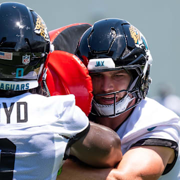 Jacksonville Jaguars linebacker Jack Kiser (54) makes a run at Jacksonville Jaguars linebacker Devin Lloyd (0) during a tackling drill during the fourth organized team activity at the Miller Electric Center in Jacksonville, Fla. Tuesday, May 27, 2025. [Doug Engle/Florida Times-Union]
