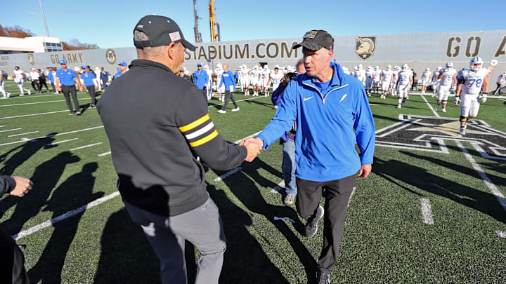 Nov 2, 2024; West Point, New York, USA; Air Force Falcons head coach Troy Calhoun shakes hands with Army Black Knights head coach Jeff Monken after Army’s 20-3 win at Michie Stadium. 