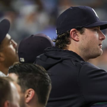 Jun 5, 2024; Bronx, New York, USA; New York Yankees pitcher Gerrit Cole (45) looks on from the dug out during the eighth inning against the Minnesota Twins at Yankee Stadium. Mandatory Credit: Vincent Carchietta-USA TODAY Sports