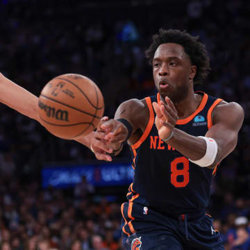 Apr 22, 2024; New York, New York, USA;  New York Knicks forward OG Anunoby (8) passes the ball in front of Philadelphia 76ers forward Nicolas Batum (40) during the second half during game two of the first round for the 2024 NBA playoffs at Madison Square Garden. Mandatory Credit: Vincent Carchietta-USA TODAY Sports
