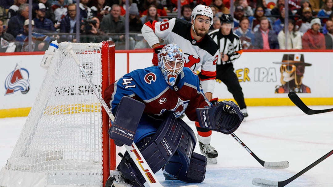 Oct 28, 2025; Denver, Colorado, USA; Colorado Avalanche goaltender Scott Wedgewood (41) watches the puck as New Jersey Devils right wing Timo Meier (28) looks on in the first period at Ball Arena. Mandatory Credit: Isaiah J. Downing-Imagn Images