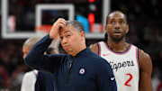 Feb 2, 2025; Toronto, Ontario, CAN;  Los Angeles Clippers head coach Tyronn Lue scratches his head after calling a time out as forward Kawhi Leonard (2) walks past in the first half against the Toronto Raptors at Scotiabank Arena. Mandatory Credit: Dan Hamilton-Imagn Images