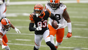 Oct 25, 2020; Cincinnati, Ohio, USA; Cincinnati Bengals wide receiver Tyler Boyd (83)evades Cleveland Browns cornerback Kevin Johnson (28)and defensive tackle Sheldon Richardson (98) in the fourth quarter at Paul Brown Stadium. Mandatory Credit: Joseph Maiorana-Imagn Images