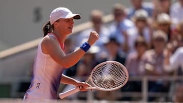 Jun 6, 2024; Paris, France; Iga Swiatek of Poland celebrates winning her match against Coco Gauff of the United States on day 12 of Roland Garros at Stade Roland Garros. Mandatory Credit: Susan Mullane-USA TODAY Sports