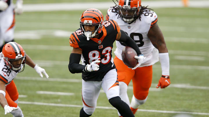 Oct 25, 2020; Cincinnati, Ohio, USA; Cincinnati Bengals wide receiver Tyler Boyd (83)evades Cleveland Browns cornerback Kevin Johnson (28)and defensive tackle Sheldon Richardson (98) in the fourth quarter at Paul Brown Stadium. Mandatory Credit: Joseph Maiorana-Imagn Images