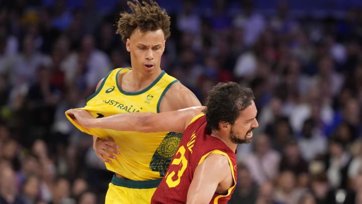 Jul 27, 2024; Villeneuve-d'Ascq, France; Spain guard Sergio Llull (23) gets past Australia point guard Dyson Daniels (1)  in men's Group A play during the Paris 2024 Olympic Summer Games at Stade Pierre-Mauroy. Mandatory Credit: John David Mercer-USA TODAY Sports