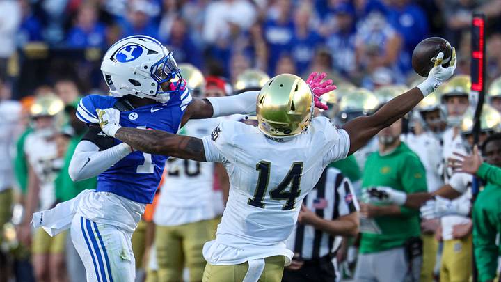 Oct 17, 2026; Provo, Utah, USA; Notre Dame Fighting Irish wide receiver Micah Gilbert (14) makes a one handed catch against Brigham Young Cougars cornerback Therrian Alexander (1) during the first half during the first half at LaVell Edwards Stadium. Mandatory Credit: Rob Gray-Imagn Images