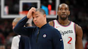 Feb 2, 2025; Toronto, Ontario, CAN;  Los Angeles Clippers head coach Tyronn Lue scratches his head after calling a time out as forward Kawhi Leonard (2) walks past in the first half against the Toronto Raptors at Scotiabank Arena. Mandatory Credit: Dan Hamilton-Imagn Images