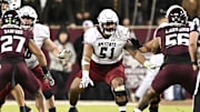 Nov 16, 2024; College Station, Texas, USA; New Mexico State Aggies offensive lineman AJ Vaipulu (51) blocks against the Texas A&M Aggies during the second half at Kyle Field. Mandatory Credit: Maria Lysaker-Imagn Images 