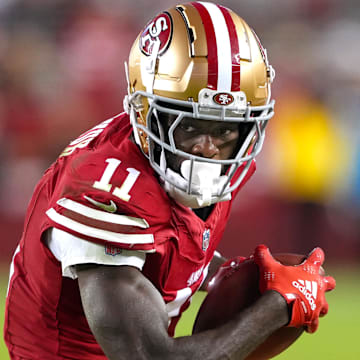 Sep 9, 2024; Santa Clara, California, USA; San Francisco 49ers wide receiver Brandon Aiyuk (11) runs after a catch against the New York Jets during the fourth quarter at Levi's Stadium. Mandatory Credit: Darren Yamashita-Imagn Images