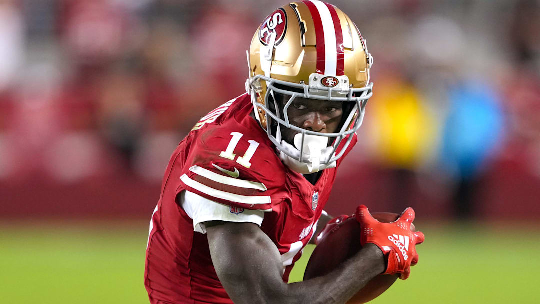Sep 9, 2024; Santa Clara, California, USA; San Francisco 49ers wide receiver Brandon Aiyuk (11) runs after a catch against the New York Jets during the fourth quarter at Levi's Stadium. Mandatory Credit: Darren Yamashita-Imagn Images