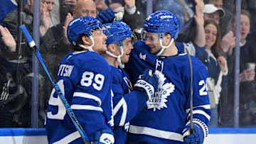 Mar 25, 2025; Toronto, Ontario, CAN;  Toronto Maple Leafs forward Max Domi (11) celebrates with forwards Nick Robertson (89) and Scott Laughton (24) after scoring a goal against the Philadelphia Flyers in the third period at Scotiabank Arena. Mandatory Credit: Dan Hamilton-Imagn Images