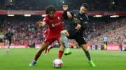 Trent Alexander-Arnold was locked in a battle with Arsenal's Gabriel Martinelli (right) throughout the match