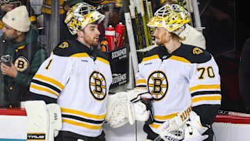 Dec 17, 2024; Calgary, Alberta, CAN; Boston Bruins goaltender Jeremy Swayman (1) and goaltender Joonas Korpisalo (70) during the warmup period against the Calgary Flames at Scotiabank Saddledome. Mandatory Credit: Sergei Belski-Imagn Images merp