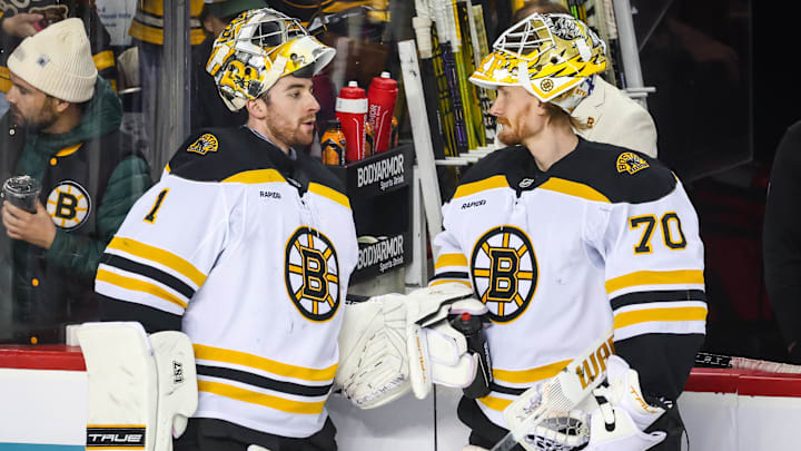 Dec 17, 2024; Calgary, Alberta, CAN; Boston Bruins goaltender Jeremy Swayman (1) and goaltender Joonas Korpisalo (70) during the warmup period against the Calgary Flames at Scotiabank Saddledome. Mandatory Credit: Sergei Belski-Imagn Images merp