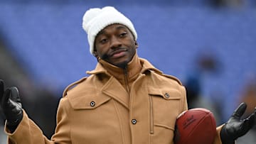 Jan 20, 2024; Baltimore, MD, USA; ESPN college football and NFL analyst Robert Griffin III reacts on the sidelines before a 2024 AFC divisional round game between the Houston Texans and the Baltimore Ravens at M&T Bank Stadium. Mandatory Credit: Tommy Gilligan-Imagn Images