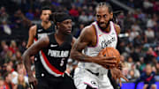 Oct 26, 2025; Inglewood, California, USA; Los Angeles Clippers forward Kawhi Leonard (2) moves the ball against Portland Trail Blazers guard Jrue Holiday (5) during the first half at Intuit Dome. Mandatory Credit: Gary A. Vasquez-Imagn Images