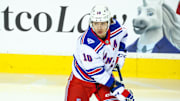 Oct 26, 2025; Calgary, Alberta, CAN; New York Rangers left wing Artemi Panarin (10) skates during the warmup period against the Calgary Flames at Scotiabank Saddledome. Mandatory Credit: Sergei Belski-Imagn Images
