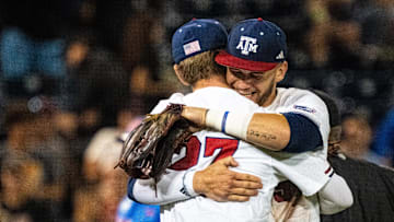 Jun 15, 2024; Omaha, NE, USA; Texas A&M Aggies first baseman Ted Burton (27) and pitcher Evan Aschenbeck (53) embrace after defeating the Florida Gators at Charles Schwab Field Omaha. Mandatory Credit: Dylan Widger-USA TODAY Sports