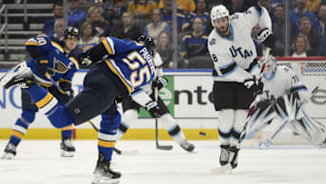Apr 15, 2025; St. Louis, Missouri, USA; Utah Hockey Club center Nick Schmaltz (8) attempts to block a shot from St. Louis Blues defenseman Colton Parayko (55) during the third period at Enterprise Center. Mandatory Credit: Jeff Le-Imagn Images
