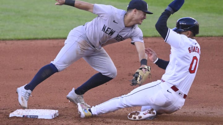 Apr 13, 2024; Cleveland, Ohio, USA; Cleveland Guardians second baseman Andres Gimenez (0) is forced out at second base by New York Yankees shortstop Anthony Volpe (11) in the fourth inning at Progressive Field. Mandatory Credit: David Richard-USA TODAY Sports