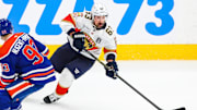 Jun 14, 2025; Edmonton, Alberta, CAN; Florida Panthers center Brad Marchand (63) skates with the puck against Edmonton Oilers center Ryan Nugent-Hopkins (93) during the second period in game five of the 2025 Stanley Cup Final at Rogers Place. Mandatory Credit: Sergei Belski-Imagn Images