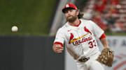 Aug 11, 2025; St. Louis, Missouri, USA;  St. Louis Cardinals second baseman Brendan Donovan (33) flips the ball to first base during the ninth inning against the Colorado Rockies at Busch Stadium. Mandatory Credit: Jeff Curry-Imagn Images