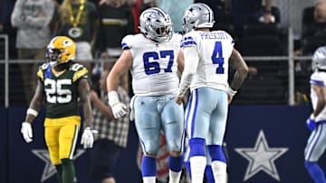 Sep 28, 2025; Arlington, Texas, USA; Dallas Cowboys quarterback Dak Prescott (4) celebrates with center Brock Hoffman (67) after a touchdown in the second quarter against the Green Bay Packers at AT&T Stadium. Mandatory Credit: Jerome Miron-Imagn Images
