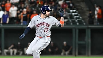Aug 22, 2025; Baltimore, Maryland, USA; Houston Astros catcher Victor Caratini (17) hits a two-run double during the eighth inning against the Baltimore Orioles at Oriole Park at Camden Yards. 