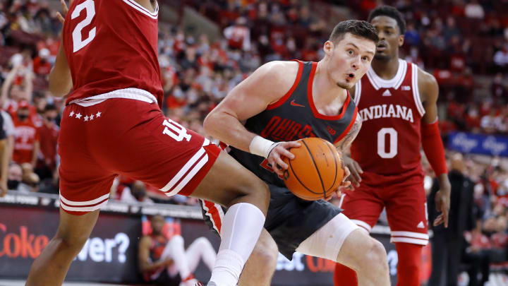 Feb 21, 2022; Columbus, Ohio, USA;  Ohio State Buckeyes forward Kyle Young (25) controls the ball defended by Indiana Hoosiers center Michael Durr (2) during the second half at Value City Arena. Mandatory Credit: Joseph Maiorana-USA TODAY Sports