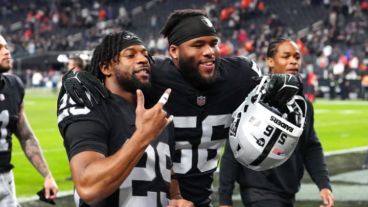 Jan 7, 2024; Paradise, Nevada, USA; Las Vegas Raiders safety Chris Smith II (29) and Las Vegas Raiders linebacker Amari Burney (56) celebrate after the Raiders defeated the Denver Broncos 27-14 at Allegiant Stadium. Mandatory Credit: Stephen R. Sylvanie-USA TODAY Sports