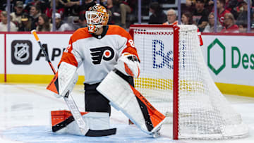 Apr 13, 2025; Ottawa, Ontario, CAN; Philadelphia Flyers goalie Ivan Fedotov (82) stretches prior to the start of game against the Ottawa Senators at the Canadian Tire Centre. Mandatory Credit: Marc DesRosiers-Imagn Images