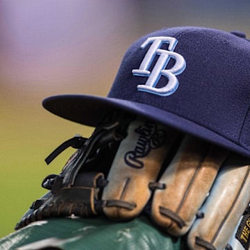 Aug 15, 2015; Arlington, TX, USA; A view of a Tampa Bay Rays ball cap and glove during the game between the Texas Rangers and the Tampa Bay Rays at Globe Life Park in Arlington. The Rangers defeated the Rays 12-4. Mandatory Credit: Jerome Miron-Imagn Images