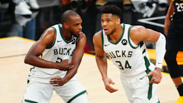 Jul 8, 2021; Phoenix, Arizona, USA; Milwaukee Bucks forward Giannis Antetokounmpo (34) and Khris Middleton (22) against the Phoenix Suns in game two of the 2021 NBA Finals at Phoenix Suns Arena. Mandatory Credit: Mark J. Rebilas-Imagn Images