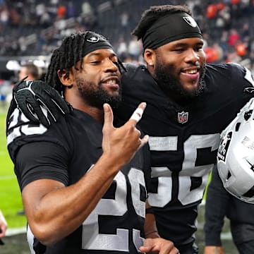 Jan 7, 2024; Paradise, Nevada, USA; Las Vegas Raiders safety Chris Smith II (29) and Las Vegas Raiders linebacker Amari Burney (56) celebrate after the Raiders defeated the Denver Broncos 27-14 at Allegiant Stadium. Mandatory Credit: Stephen R. Sylvanie-Imagn Images