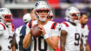 Aug 16, 2025; Minneapolis, Minnesota, USA;  New England Patriots quarterback Drake Maye (10) warms up before the game against the Minnesota Vikings at U.S. Bank Stadium. Mandatory Credit: Jeffrey Becker-Imagn Images