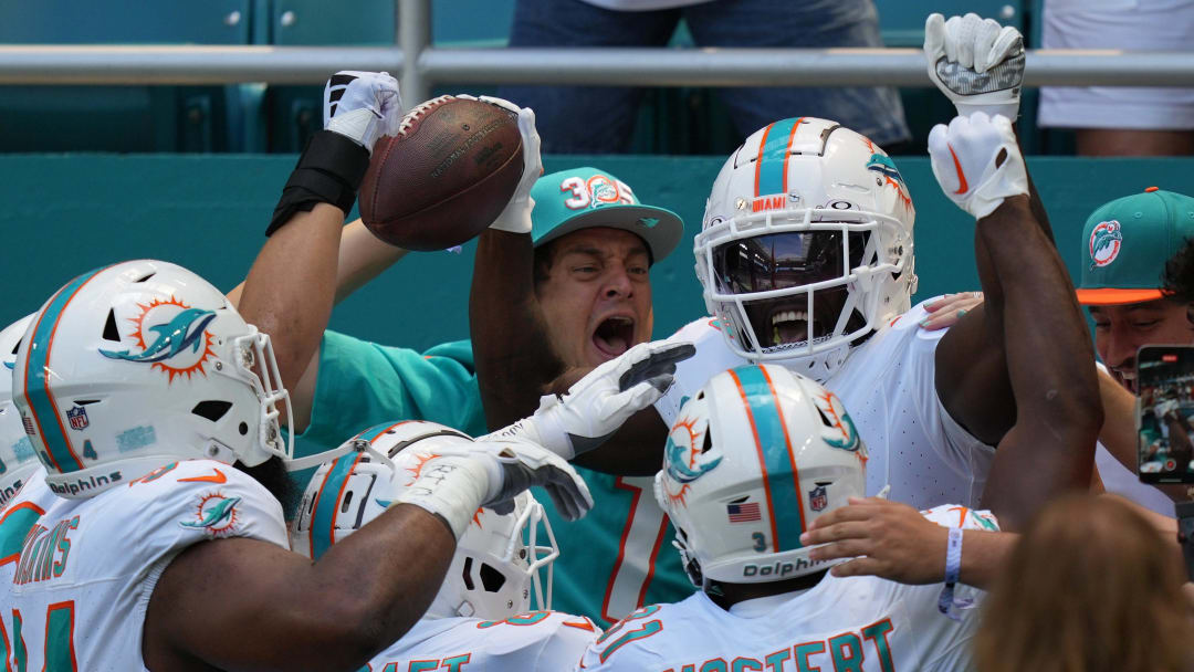 Miami Dolphins wide receiver Tyreek Hill (10) celebrates scoring a touchdown against the Denver Broncos during the first half of an NFL game from the stands at Hard Rock Stadium in Miami Gardens, Sept. 24, 2023.