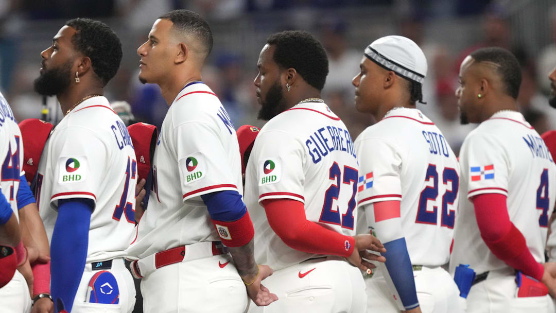 Dominican Republic third baseman Junior Caminero (13), third baseman Manny Machado (3), first baseman Vladimir Guerrero Jr. (27), right fielder Juan Soto (22) and second baseman Ketel Marte (4) participate in pregame ceremonies before the game against Nicaragua at loanDepot Park. 