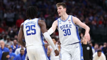 Mar 31, 2024; Dallas, TX, USA;  Duke Blue Devils forward Mark Mitchell (25) and center Kyle Filipowski (30) react in the first half against the North Carolina State Wolfpack in the finals of the South Regional of the 2024 NCAA Tournament at American Airline Center. Mandatory Credit: Kevin Jairaj-USA TODAY Sports