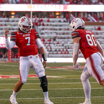 Aug 29, 2024; Salt Lake City, Utah, USA; Utah Utes quarterback Cameron Rising (7) and tight end Brant Kuithe (80) celebrate a touchdown against the Southern Utah Thunderbirds during the second quarter at Rice-Eccles Stadium. Mandatory Credit: Rob Gray-Imagn Images