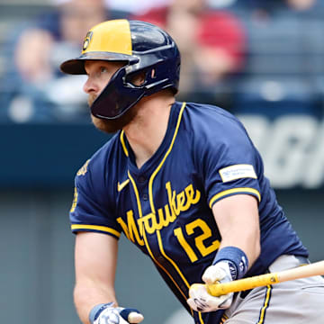Milwaukee Brewers first baseman Rhys Hoskins (12) hits an RBI single during the ninth inning against the Cleveland Guardians at Progressive Field on May 14.