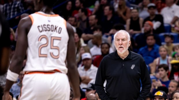 Apr 5, 2024; New Orleans, Louisiana, USA; San Antonio Spurs head coach Gregg Popovich gives direction to guard Sidy Cissoko.